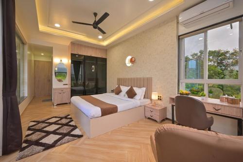 a bedroom with a bed and a large window at Saanjh Villa 6 bhk in Khamshet