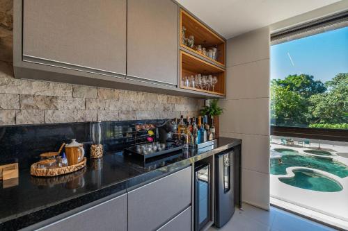 Nápoje v ubytování Pé na Areia - 2 Suítes e Jacuzzi em Condomínio de Luxo!