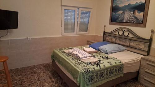 Ένα ή περισσότερα κρεβάτια σε δωμάτιο στο Villa with 4 Bedrooms and 2 Bathrooms and 1 Pool