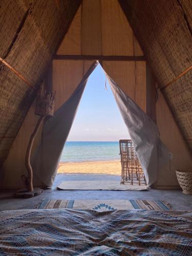 a tent with a view of the beach at Sukoon Nuweibaa in Nuweiba
