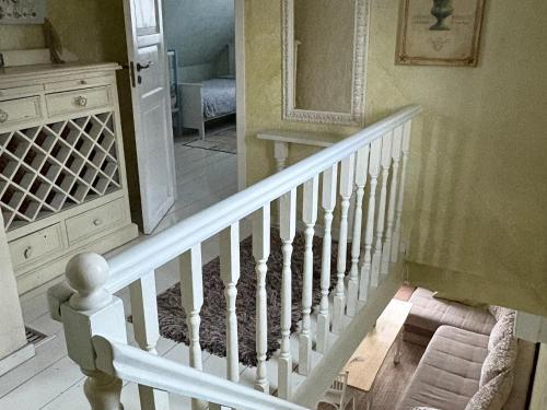 a staircase in a house with a white stair case at House in the City in Tallinn