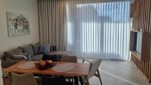 a living room with a table and a couch at Beachfront in Ga‘ash