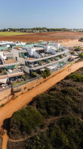 an aerial view of a building on a dirt road at Beachfront in Ga‘ash