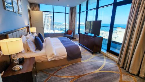 Ένα ή περισσότερα κρεβάτια σε δωμάτιο στο Sherao Hotel Doha فندق شراعوه الدوحة