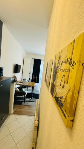 a room with a wall with posters on it at Ferienwohnung Jurga in Pirna