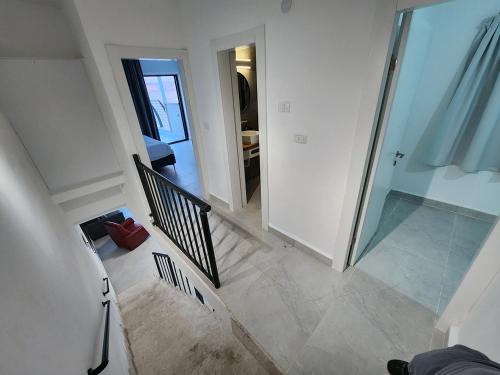 an overhead view of a staircase in a house at דופלקס כנרת in Tiberias