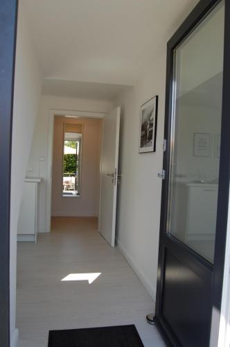 a hallway with a door leading into a room at Ferienwohnung Anni in Schneverdingen