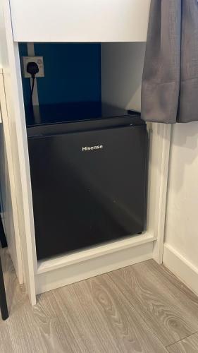 a flat screen television in a corner of a room at Hotel Apsara Temerloh Gateway in Temerloh