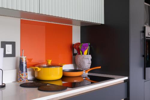 a kitchen with a stove with pots and pans at SuPaViews in Wilderness