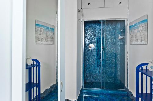a shower with a glass door in a bathroom at La Casa di Vania in Ravello