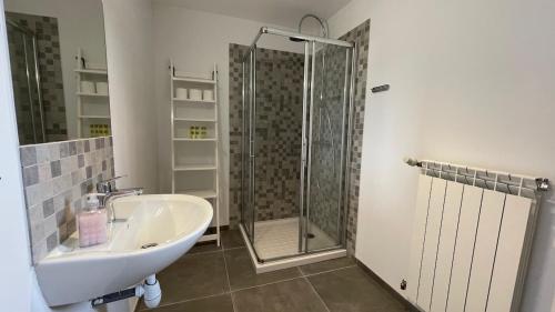 a bathroom with a shower and a sink at Modern apartment centrally located in Quarante in Quarante
