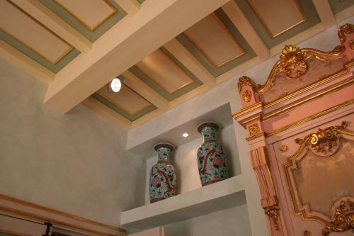 two vases sitting on a shelf in a room at Tenuta Del Gallo in Amelia