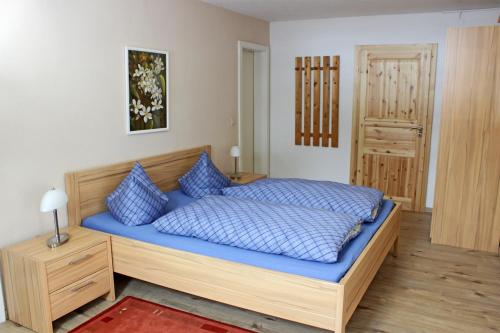 Postel nebo postele na pokoji v ubytování Berggasthof Lusen