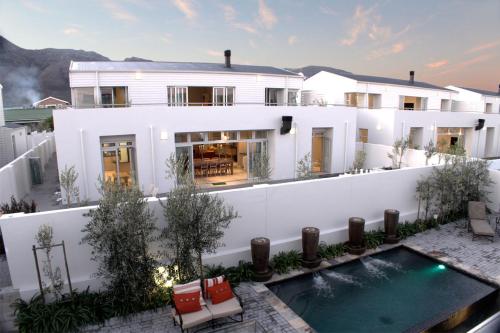 an aerial view of a house with a swimming pool at Spatalla Holiday Homes in Kleinmond