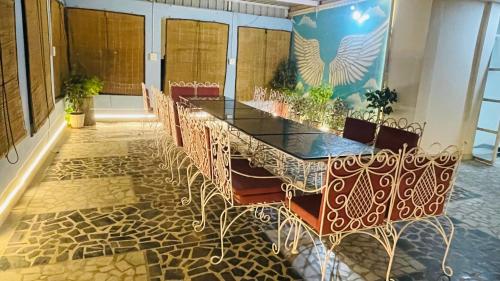 a conference room with a long table and chairs at Emperor Palace A Heritage villa in Udaipur