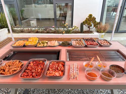 a buffet with many dishes of food on a table at Xizhou Feng Shangju in Dali