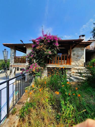 a house with flowers on the side of it at Villa iksir in Selcuk