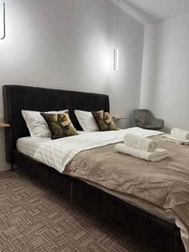 Giường trong phòng chung tại Muha ApartHotel