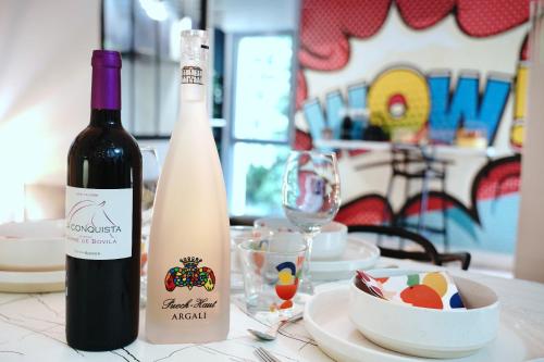 a bottle of wine and a glass on a table at L'Instant WOW! in Cahors