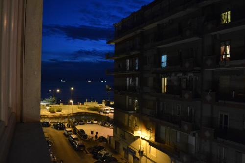 a view from a window of a building at night at Dimora Tafuri in Salerno