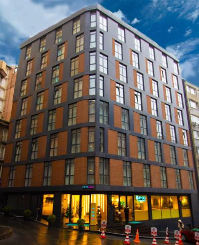 a building on a street with orange cones in front at Bird Nest Suites in Istanbul