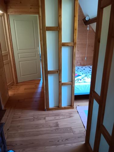 a room with a bunk bed and a door at Penstone Grange in Campan