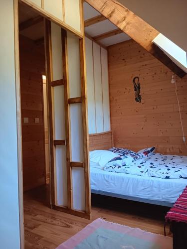 a room with a bed in a wooden cabin at Penstone Grange in Campan