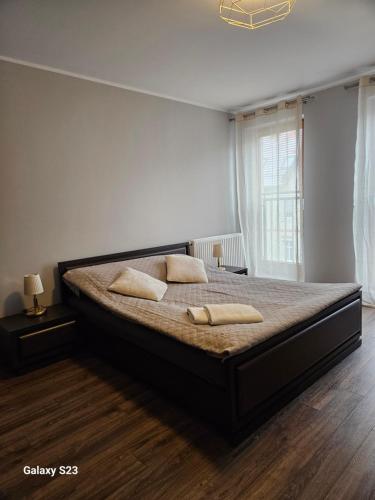 Postel nebo postele na pokoji v ubytování Apartament Stary Browar