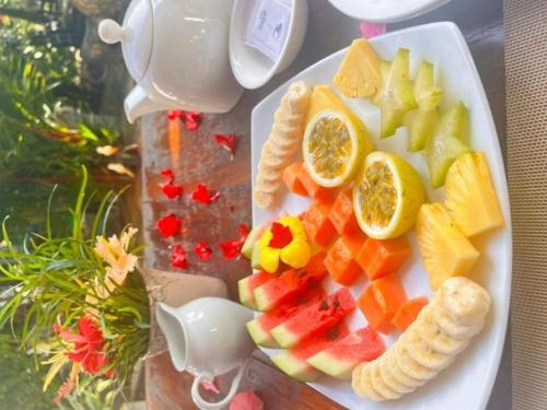 a plate of fruit on a teapot at La Perla Bentota in Bentota