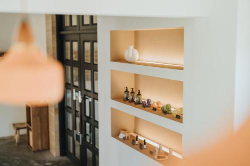a room with a shelf with bottles on it at Yanyu Yuchi BY REINDEER in Yuchi