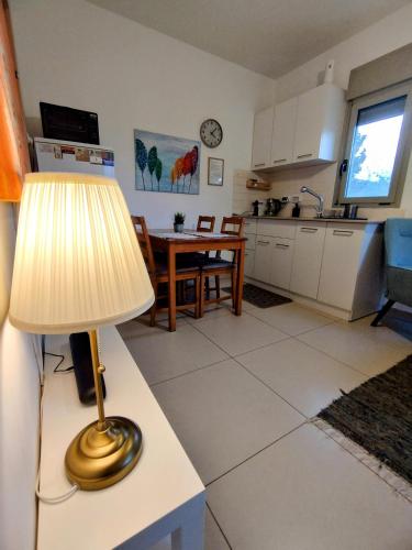 a lamp sitting on a table in a kitchen at Tavor view נוף תבור in Daverat