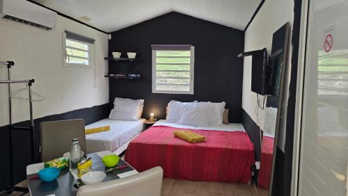 Postel nebo postele na pokoji v ubytování Hébergement Chez l'Habitant - Idéal pour Visiter la Martinique