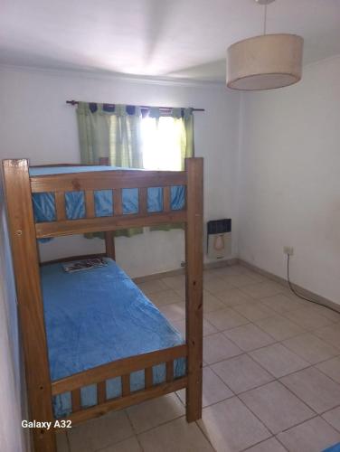 a bedroom with two bunk beds in a room at Casa Quequen in Quequén
