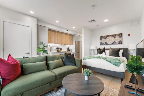 a living room with a couch and a bed at Furnished Apartment in South Boston in Boston