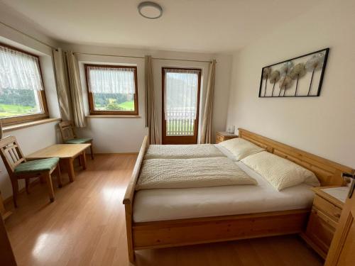 Postel nebo postele na pokoji v ubytování Brunnerhof