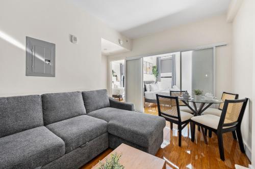 a living room with a couch and a table at Furnished Apartment in Downtown in Boston
