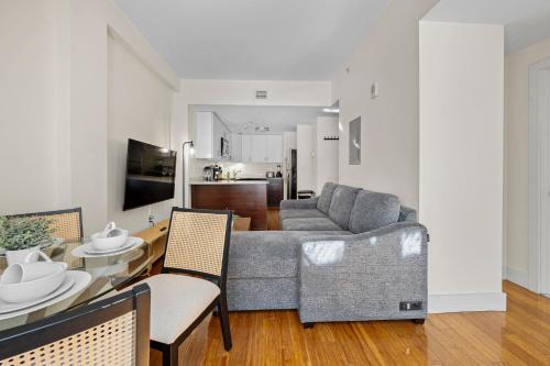 a living room with a couch and a table at Furnished Apartment in Downtown in Boston