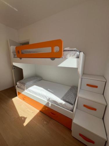 a small bedroom with a bunk bed with drawers at Suite house Palazzo La Fenicia in Giovinazzo
