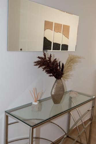 a glass table with a vase on top of it at Villa Angela in Šmrika