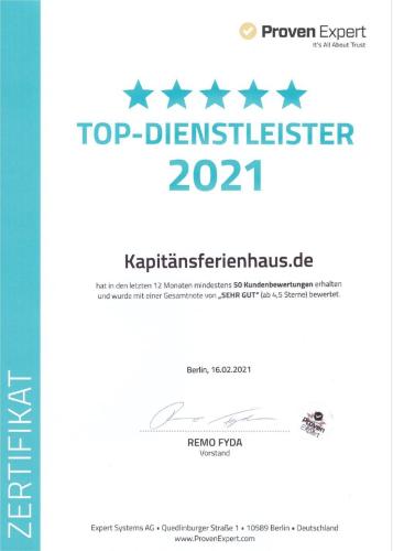 a poster for a top disasteritizer with five stars at Wohlfuehl-Orte24 am Hafen in Schaprode, Rügen in Schaprode