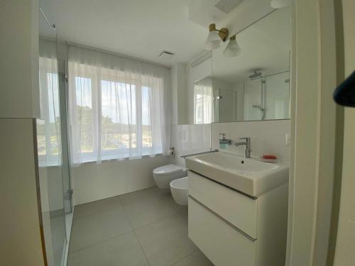 Et badeværelse på Strandläufer mit Meerblick und Balkon