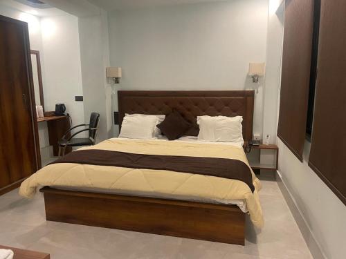 a bedroom with a large bed in a room at BLUE ANGEL Guest House in Shillong