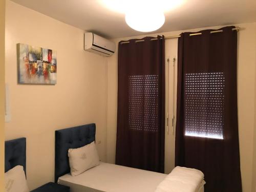 Postel nebo postele na pokoji v ubytování Appartement Simouni