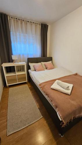 Postel nebo postele na pokoji v ubytování Apartman Angel