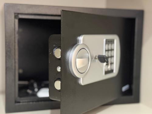 a black box with a door with a knob at BlueVista - Yacht like Escape with Ocean Views in Rabat