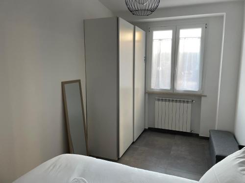 a bedroom with a bed and a window at Casa sul mare con accesso diretto in spiaggia I in Focene