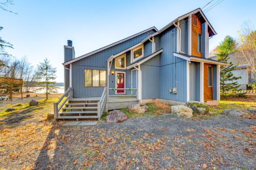 a blue house with a staircase in front of it at Lakefront Cabin Kayaks, Paddle Boards and Fishing in Pocono Lake