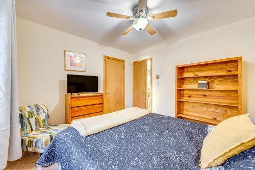 a bedroom with a bed and a ceiling fan at Lakefront Cabin Kayaks, Paddle Boards and Fishing in Pocono Lake