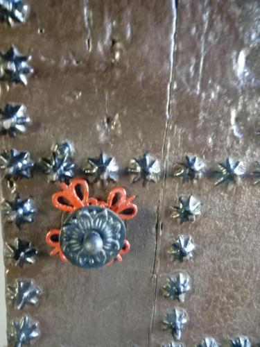 a pair of scissors sitting on top of silver stars at Casa de Comedias in Almagro