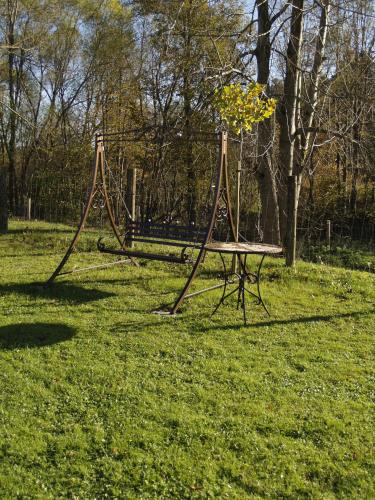 a swing set in a field of grass at U Małgorzaty in Wojtkowa